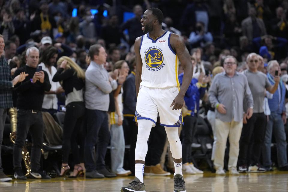 Golden State Warriors forward Draymond Green (23) celebrates with the crowd in the final second of Game 4 of an NBA basketball Western Conference playoff semifinal against the Memphis Grizzlies in San Francisco, Monday, May 9, 2022. The Warriors won 101-98. (AP Photo/Tony Avelar)