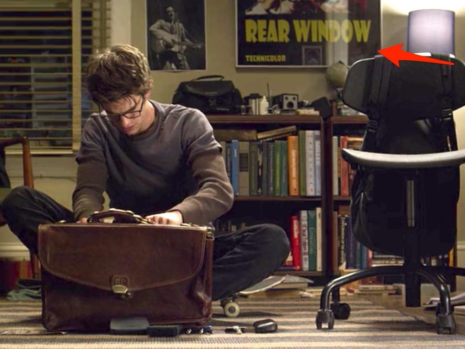 Peter Parker opening a briefcase in "The Amazing Spider-Man."