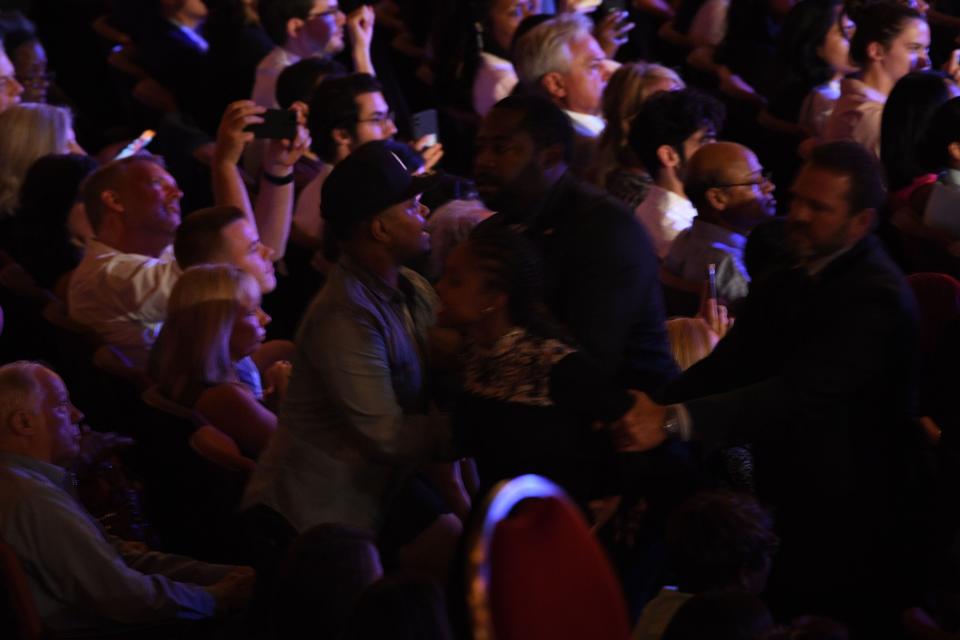 Protesters are removed as Democratic presidential hopefuls deliver opening remarks during the second round of the second Democratic primary debate of the 2020 presidential campaign season hosted by CNN at the Fox Theatre in Detroit, Michigan on July 31, 2019. - Protesters changed 