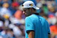 Aug 19, 2017; Mason, OH, USA; John Isner (USA) reacts against Grigor Dimitrov (ESP) during the Western and Southern Open at the Lindner Family Tennis Center. Mandatory Credit: Aaron Doster-USA TODAY Sports