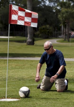 FootGolfer Bobby Rodriguez drops to his knees after missing a putt at Largo Golf Course in Largo, Florida April 11, 2015. REUTERS/Scott Audette