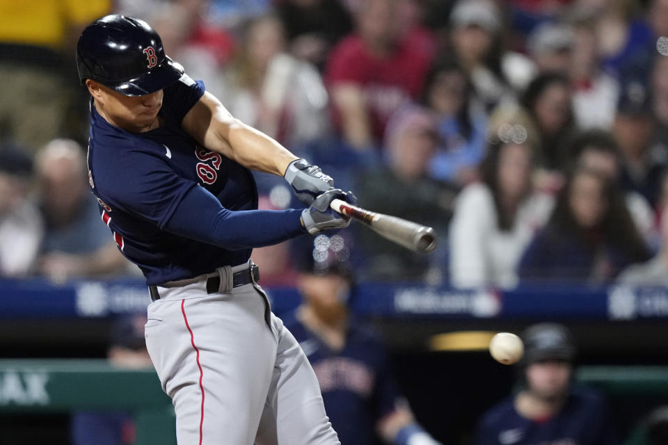 Boston Red Sox's Rob Refsnyder hits a two-run double against Philadelphia Phillies pitcher Connor Brogdon during the sixth inning of a baseball game, Saturday, May 6, 2023, in Philadelphia. (AP Photo/Matt Slocum)