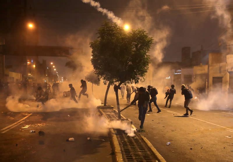 Demonstrators clash with police during protests following the impeachment of President Martin Vizcarra, in Lima