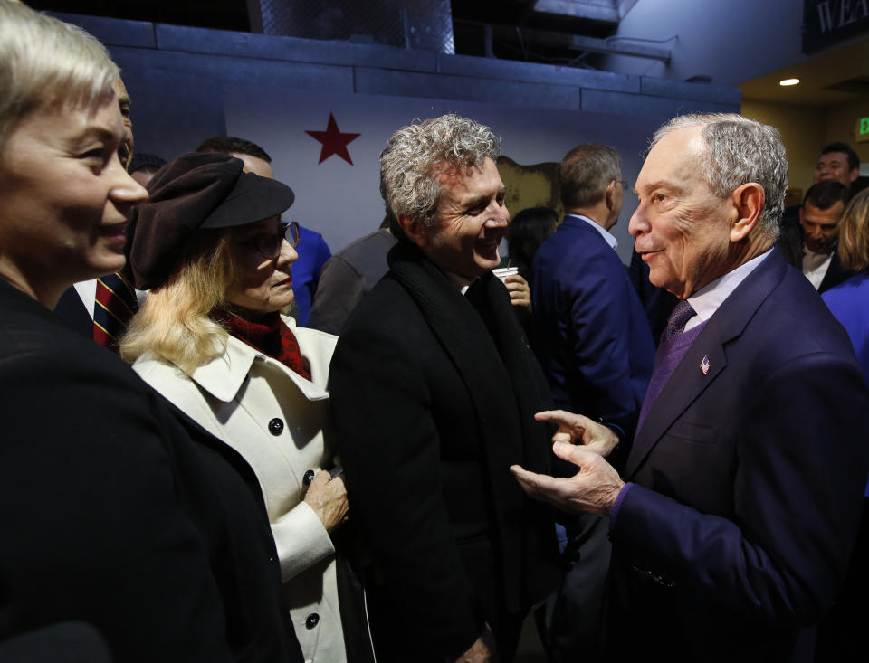 Democratic presidential candidate and former New York City Mayor Michael Bloomberg, right, meets with supporters during a campaign stop in Sacramento, Calif., Monday, Feb. 3, 2020. (AP Photo/Rich Pedroncelli)