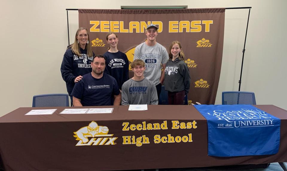 Marty Landes (center) surrounded by his family after committing to wrestle at Case Western Reserve University