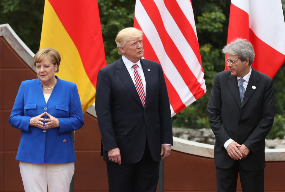From left: German Chancellor Angela Merkel, U.S. President Donald Trump and Italian Prime Minister Paolo Gentiloni arrive for the group photo at the G-7 Taormina summit on the island of Sicily on May 26, 2017. (Photo: Sean Gallup/Getty Images)