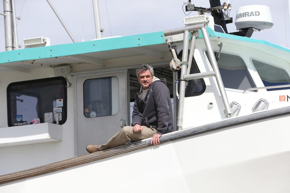 Capt. Keper Connell sits on his fishing boat, Figment at Rye Harbor on March 24, 2023. The tuna season starts in June and he said this is the time of year he thinks about the fish that got away last year and feels the excitement of the bluefin tuna he'll hook in the year to come.