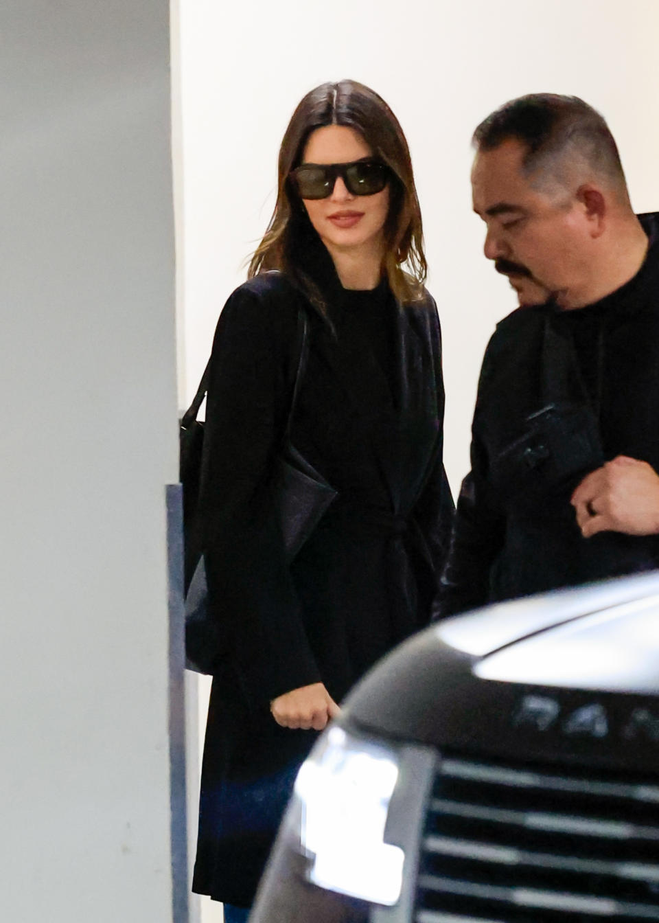 Kendall Jenner wearing a black jacket and wide-leg jeans to Sushi Park in Los Angeles May 2024