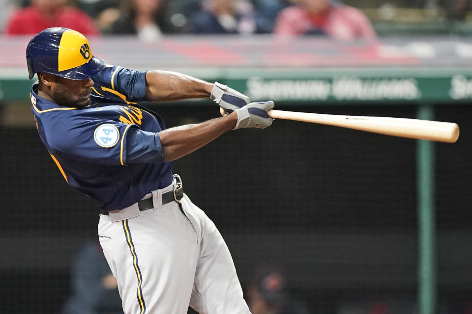 Milwaukee Brewers' Lorenzo Cain hits a grand slam during the fifth inning of the team's baseball game against the Cleveland Indians, Friday, Sept. 10, 2021, in Cleveland. (AP Photo/Tony Dejak)