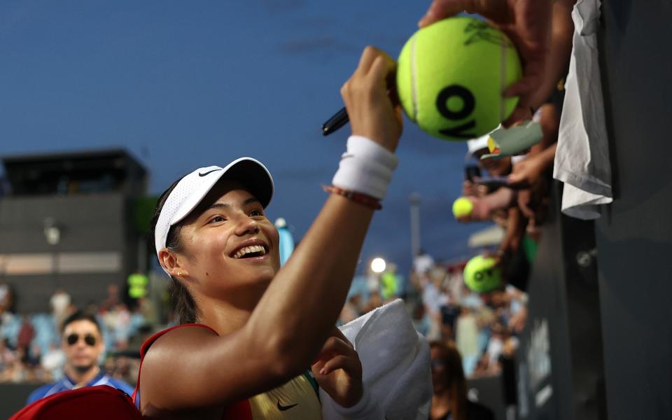 Emma Raducanu signs giant tennis balls - ‘Pain-free’ Emma Raducanu’s Australian Open joy – a year on from turning up in wheelchair