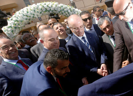 Palestinian Prime Minister Rami Hamdallah and Israeli Energy Minister Yuval Steinitz attend the inauguration of an electrical substation near the West Bank city of Jenin July 10, 2017. REUTERS/Abed Omar Qusini