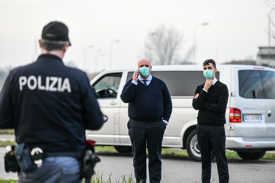 Casalpusterlengo, Italy - 23 February 2020: Italian State Police officers check cars and passengers moving in and out of the city as restrictive measures are taken to contain the outbreak of Coronavirus COVID-19 (Photo by Piero Cruciatti/Sipa USA)