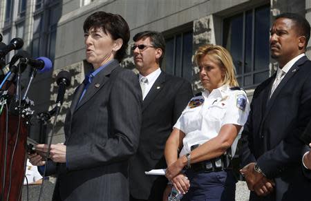 Assistant Director in Charge of the FBI's Washington Field Office Valerie Parlave (L) hosts a news conference to share the findings about the investigation into the shootings at the Navy Yard last Monday at the FBI's Washington Field Office in Washington, September 25, 2013. REUTERS/Larry Downing