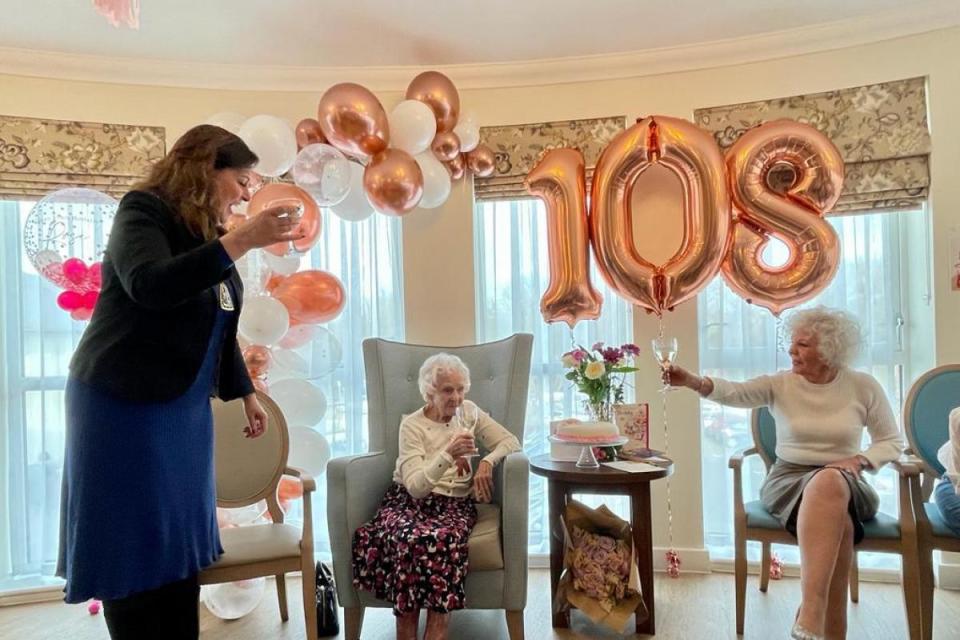 Mary Ann Clifton, known as Rosina, with Mayor of the London Borough of Bromley, Councillor Hannah Gray (left) and members of her family, as she celebrates her 108th birthday at Care UK's Foxbridge House, Orpington on Thursday. <i>(Image: PA)</i>