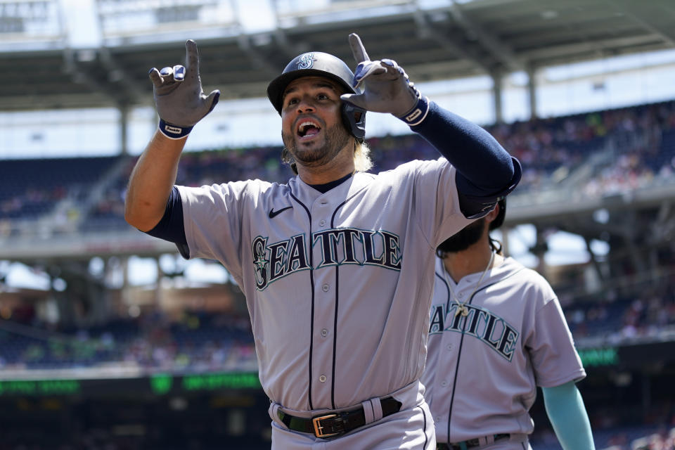 Seattle Mariners' Eugenio Suarez reacts after hitting a three-run home run in the first inning of the first game of a baseball doubleheader against the Washington Nationals, Wednesday, July 13, 2022, in Washington. (AP Photo/Patrick Semansky)