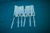 Syringes with Pfizer/Biontech COVID-19 vaccines are ready to be used at the MontLegia CHC hospital in Liege, Belgium, Wednesday, Jan. 27, 2021. The 27-nation EU is coming under criticism for the slow rollout of its vaccination campaign. The bloc, a collection of many of the richest countries in the world, is not faring well in comparison to countries like Israel, the United Kingdom and the United States. (AP Photo/Francisco Seco)