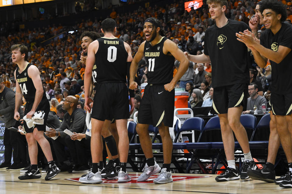 Players on the Colorado bench react during the second half of an NCAA college basketball game against Tennessee Sunday, Nov. 13, 2022, in Nashville, Tenn. Colorado won 78-66. (AP Photo/John Amis)
