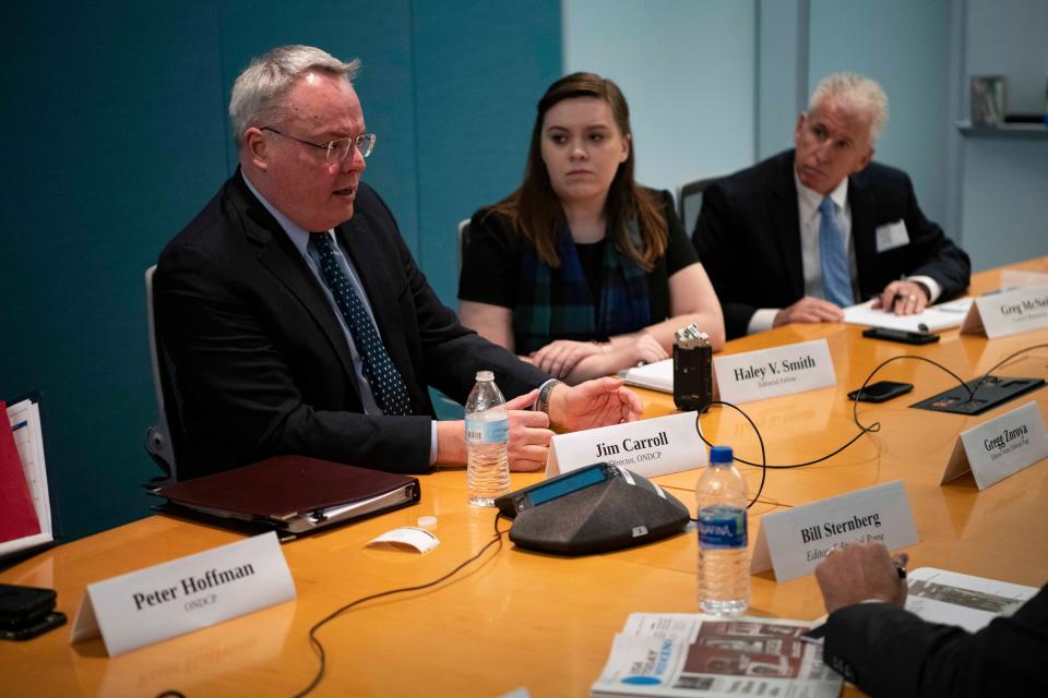 White House drug czar Jim Carroll, left, talks on Dec. 4, 2019, with the USA TODAY Editorial Board. On the right is Greg McNeil, founder of Cover2 Resources, a nonprofit organization founded in the memory of his son, Sam, who died of a heroin overdose in 2015.