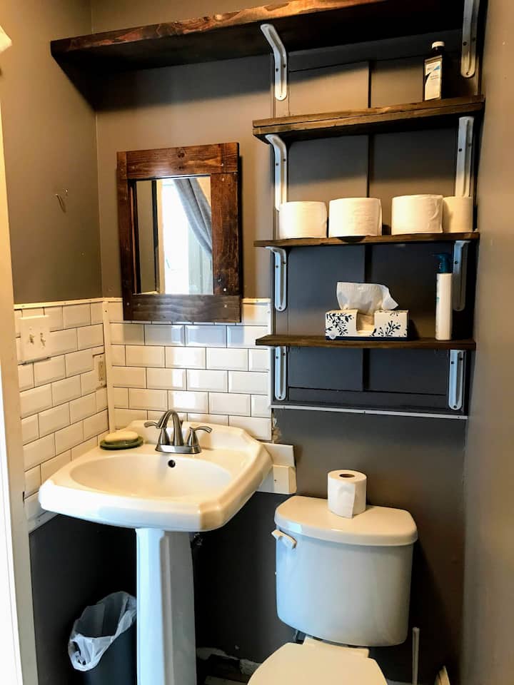 The bathroom area of a tiny home Airbnb in Trolley Square.
