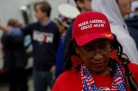 A supporter of U.S. President Donald Trump stands outside the tenth Democratic 2020 presidential debate at the Gaillard Center in Charleston