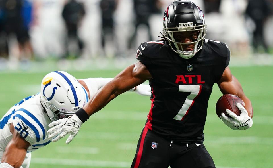 Dec 24, 2023; Atlanta, Georgia, USA; Atlanta Falcons running back Bijan Robinson (7) carries the ball against Indianapolis Colts safety Nick Cross (20) during the first half at Mercedes-Benz Stadium. Mandatory Credit: John David Mercer-USA TODAY Sports