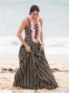 <p>The Duke and Duchess of Sussex met with a local surfing community on Bondi Beach. Meghan opted for a striped maxi dress by Australian designer Martin Grant for the occasion. On her feet, she wore a pair of Castañer espadrilles which she later took off to walk across the sand. <em>[Photo: Getty]</em> </p>