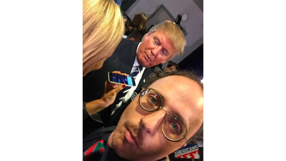 Nimrod Kamer snapping a selfie near former US president Donald Trump