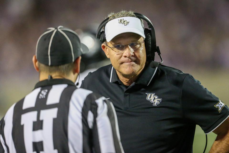 Sep 23, 2023; Manhattan, Kansas, USA; UCF Knights head coach Gus Malzahn listens to an official during the fourth quarter against the Kansas State Wildcats at Bill Snyder Family Football Stadium. Mandatory Credit: Scott Sewell-USA TODAY Sports