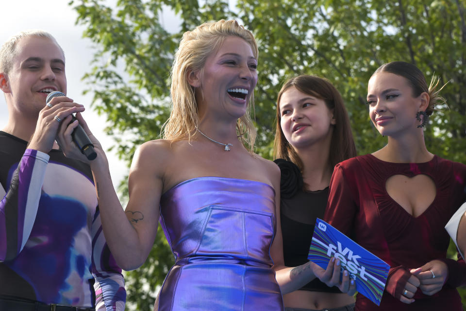 TV presenter and actress Anastasia Ivleeva, center, performs during the VK Festival in Moscow, Russia, Saturday, July 15, 2023. Ivleeva hosted a bash at a Moscow nightclub with the stated dress code of "almost naked" reflects the rise of fiercely conservative sentiment in Russia amid President Vladimir Putin's repeated denunciation of the West for trying to undermine "traditional values" and the nationalism intensified by Russia's war in Ukraine. (AP Photo)