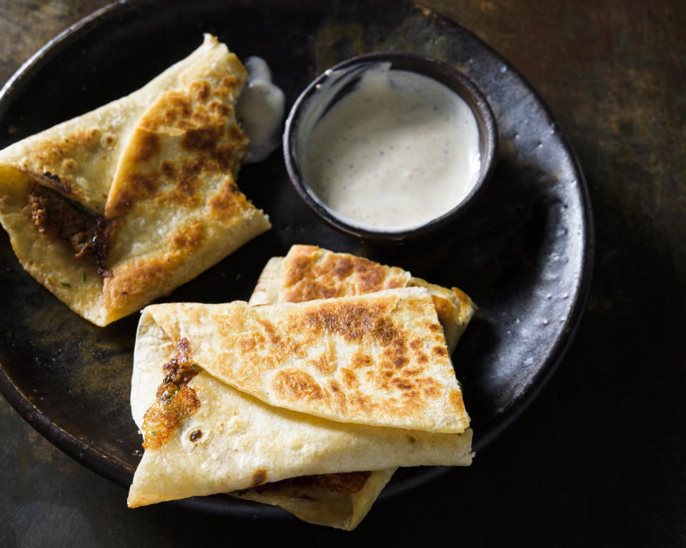 This image released by Milk Street shows a recipe for Beef Spinach Feta Gozleme. (Milk Street via AP)