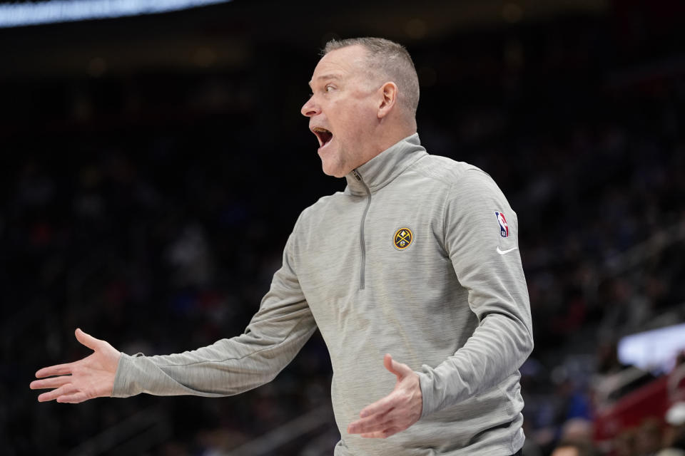 Denver Nuggets head coach Michael Malone yells from the sideline during the first half of an NBA basketball game against the Detroit Pistons, Tuesday, Jan. 25, 2022, in Detroit. (AP Photo/Carlos Osorio)