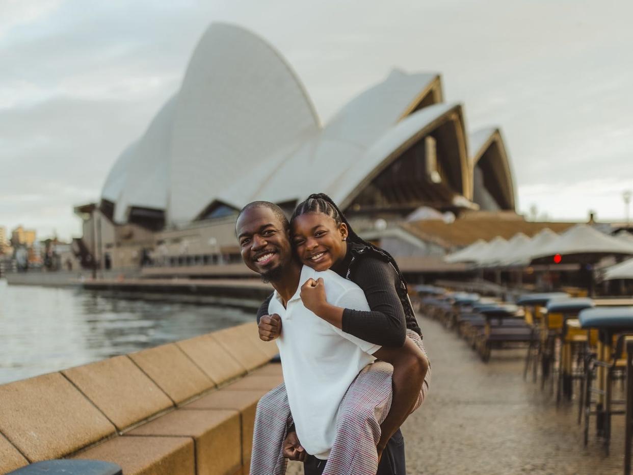 James and Jordyn Hambrick in front of the Sydney Opera House in Australia.