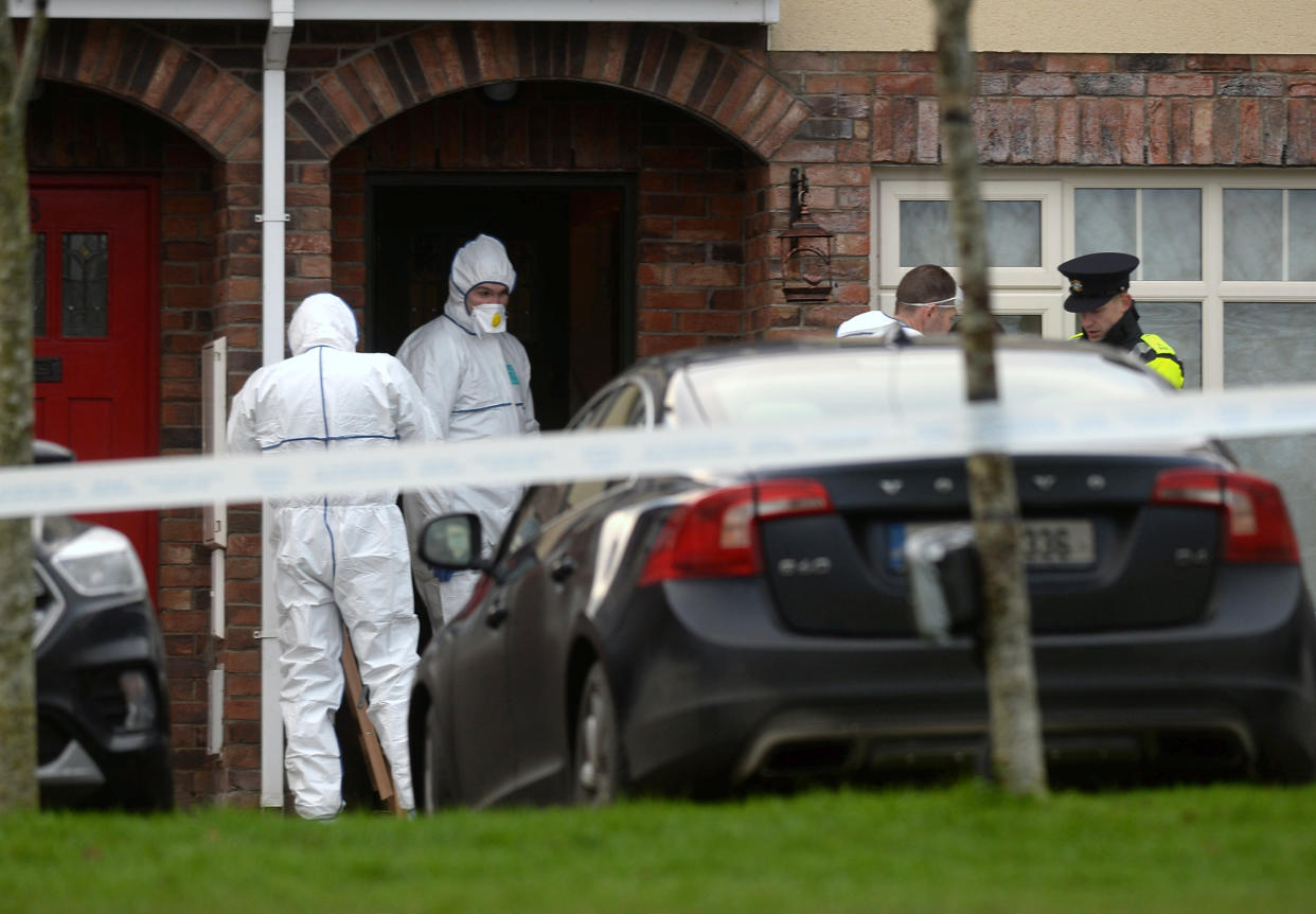 Garda forensics at a house in the village of Newcastle, south west of Dublin city where three children were found dead on Friday.