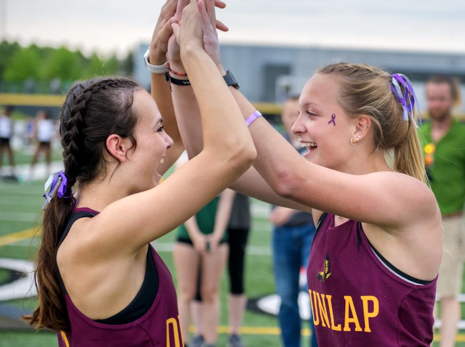 Dunlap's Chelsea Wetzel, right, celebrates with teammate Adeline Hudelson after Wetzel set a new all-time record for Peoria-area girls in the pole vault Thursday, May 11, 2023 during the Galesburg Sectional Track and Field Meet at Galesburg High School.