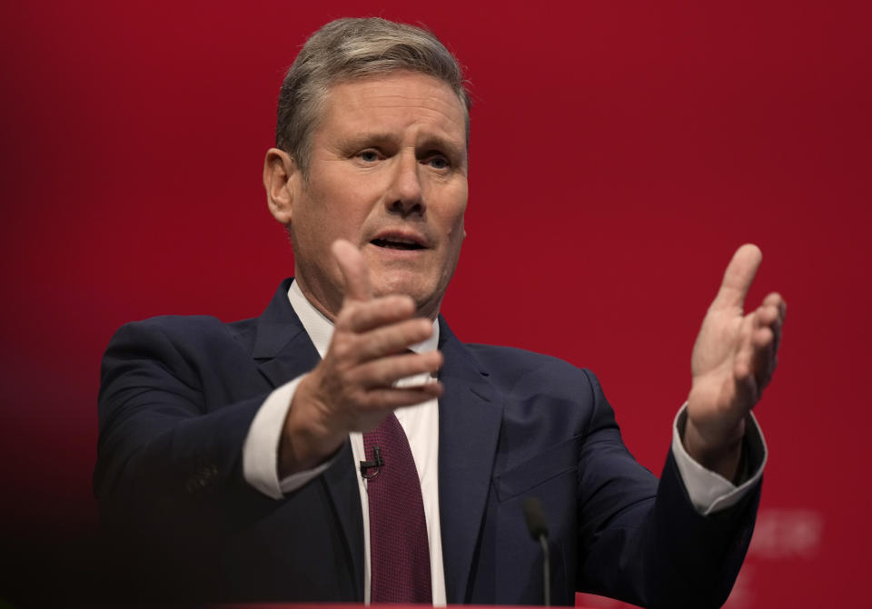 FILE - Leader of the British Labour Party Keir Starmer gestures as he makes his keynote speech at the annual party conference in Brighton, England, Sept. 29, 2021. British leader Boris Johnson is refusing Tuesday Feb. 8, 2022, to retract his claim that ppposition Labour Party leader Keir Starmer helped a sex abuser evade justice, after protesters echoed the allegation during an ugly street confrontation. (AP Photo/Alastair Grant, File)