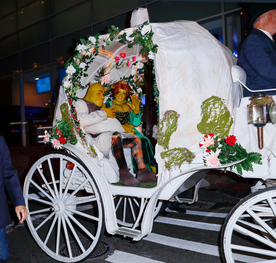 NEW YORK, NY - OCTOBER 31: Heidi Klum and Tom Kaulitz dressed up as Fiona and Shrek at her annual Halloween bash in a horse-drawn carriage on October 31, 2018 in New York City. (Photo by Jackson Lee/GC Images)