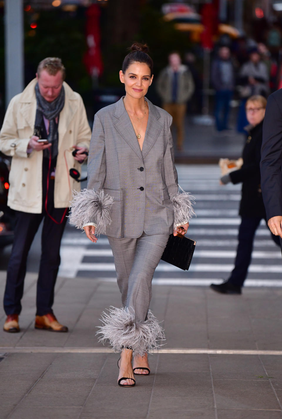 <p>Why wear a plain trouser suit when you can wear Prada’s, feather-embellished version? <em>[Photo: Getty]</em> </p>