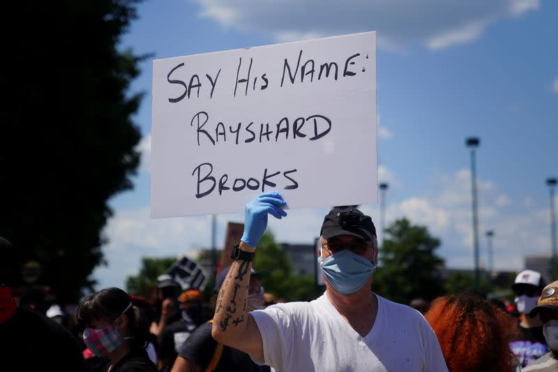 Protesters rally against racial inequality and the police shooting death of Rayshard Brooks, in Atlanta