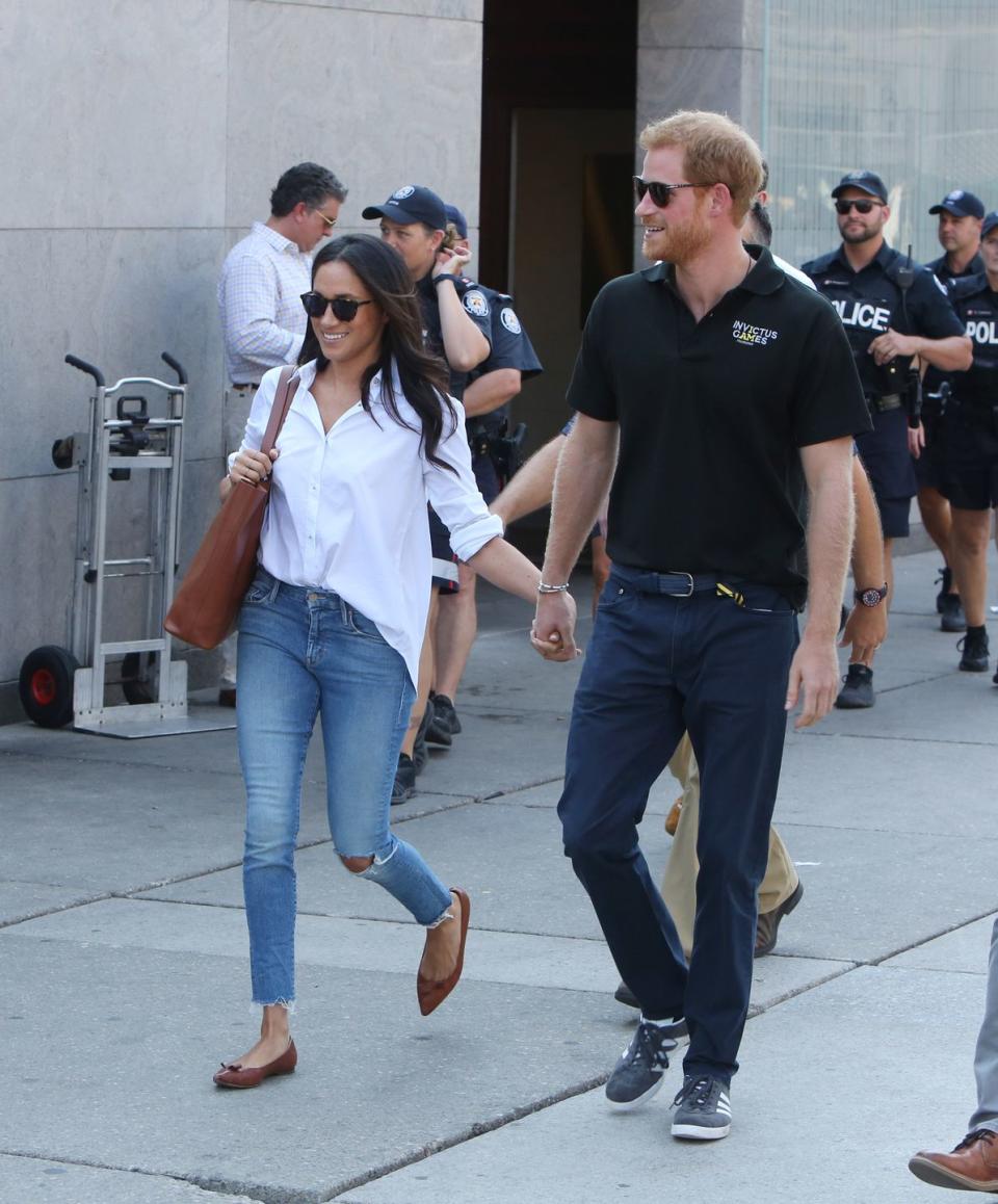 <p>Markle made an adorable appearance with Prince Harry <a href="https://www.townandcountrymag.com/society/tradition/a12466469/meghan-markle-prince-harry-hold-hands-invictus-games/" rel="nofollow noopener" target="_blank" data-ylk="slk:(please note the hand-holding!);elm:context_link;itc:0;sec:content-canvas" class="link ">(please note the hand-holding!)</a> while in Toronto for the Invictus Games. Markle kept it casual in ripped light wash jeans and a white button down shirt, complete with a brown bag and <a href="https://go.redirectingat.com?id=74968X1596630&url=https%3A%2F%2Fwww.sarahflint.com%2Fproducts%2Fnatalie-saddle-vachetta%3Fvariant%3D4419256188958&sref=https%3A%2F%2Fwww.townandcountrymag.com%2Fstyle%2Ffashion-trends%2Fg3272%2Fmeghan-markle-preppy-style%2F" rel="nofollow noopener" target="_blank" data-ylk="slk:brown flats from Sarah Flint;elm:context_link;itc:0;sec:content-canvas" class="link ">brown flats from Sarah Flint</a>. </p><p><strong>More</strong>: <a href="https://www.townandcountrymag.com/style/a12467025/meghan-markle-shoes-sarah-flint/" rel="nofollow noopener" target="_blank" data-ylk="slk:Here's Where You Can Buy Meghan Markle's Sarah Flint "Natalie" Flats;elm:context_link;itc:0;sec:content-canvas" class="link ">Here's Where You Can Buy Meghan Markle's Sarah Flint "Natalie" Flats</a><br></p>