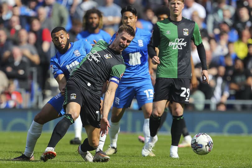 Birmingham City's Keshi Anderson battles for the ball with Coventry City's Ben Sheaf