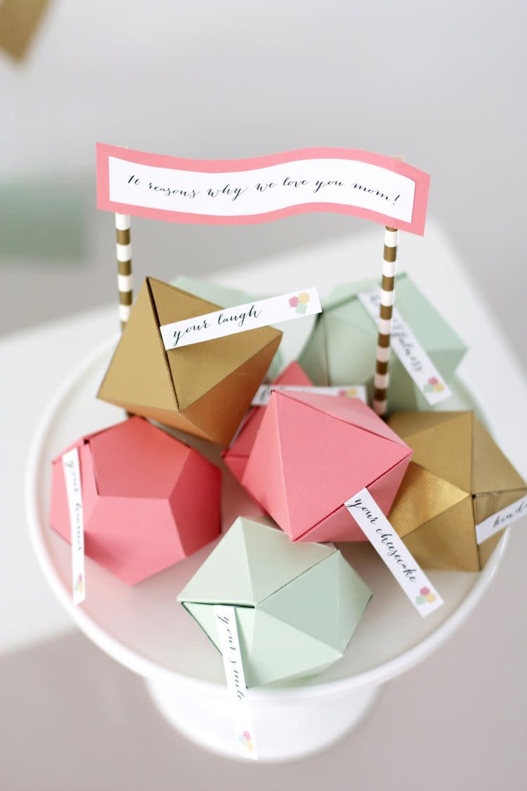 <p>All you need is an array of colored card stock to make this sentimental gift. Brainstorm all the reasons why you love mom — her award-winning apple crumble, for example — and hide them in geometric boxes. </p><p><em><a href="https://www.kristimurphy.com/blog/mothers-day-diy" rel="nofollow noopener" target="_blank" data-ylk="slk:Get the tutorial at Kristi Murphy »;elm:context_link;itc:0;sec:content-canvas" class="link ">Get the tutorial at Kristi Murphy » </a></em></p>