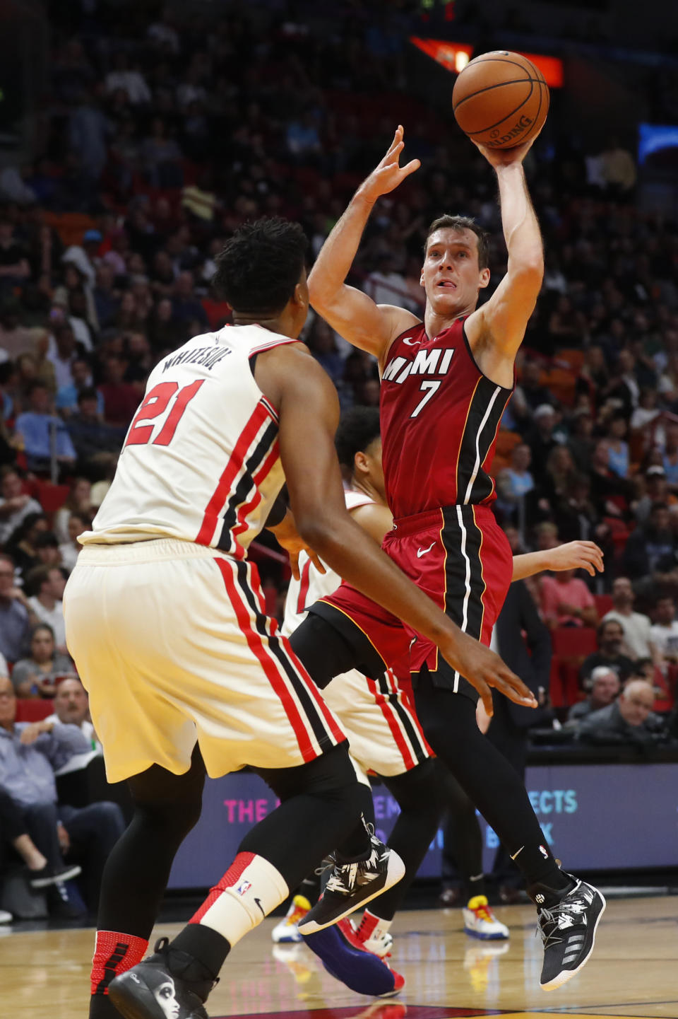 Miami Heat guard Goran Dragic (7) goes up for a shot against Portland Trail Blazers center Hassan Whiteside (21) during the second half of an NBA basketball game, Sunday, Jan. 5, 2020, in Miami. Dragic had 29 points and 13 assists as the Heat defeated the Trail Blazers 122-111. (AP Photo/Wilfredo Lee)