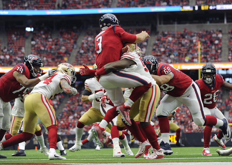 Texans quarterback Tom Savage (3) is hit by San Francisco 49ers defensive end Elvis Dumervil after throwing a pass. (AP) 