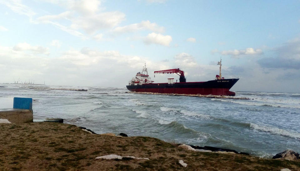 The Turkish merchant ship Efe Murat is driven aground a rocks barrier due to strong winds in Bari, Italy, Saturday, Feb. 23, 2019. (Donatella Lopez/ANSA Via AP)