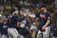 Atlanta Braves relief pitcher Will Smith, right, celebrates with catcher Travis d'Arnaud (16) after they defeated the San Diego Padres in a baseball game Saturday, Sept. 25, 2021, in San Diego. (AP Photo/Derrick Tuskan)