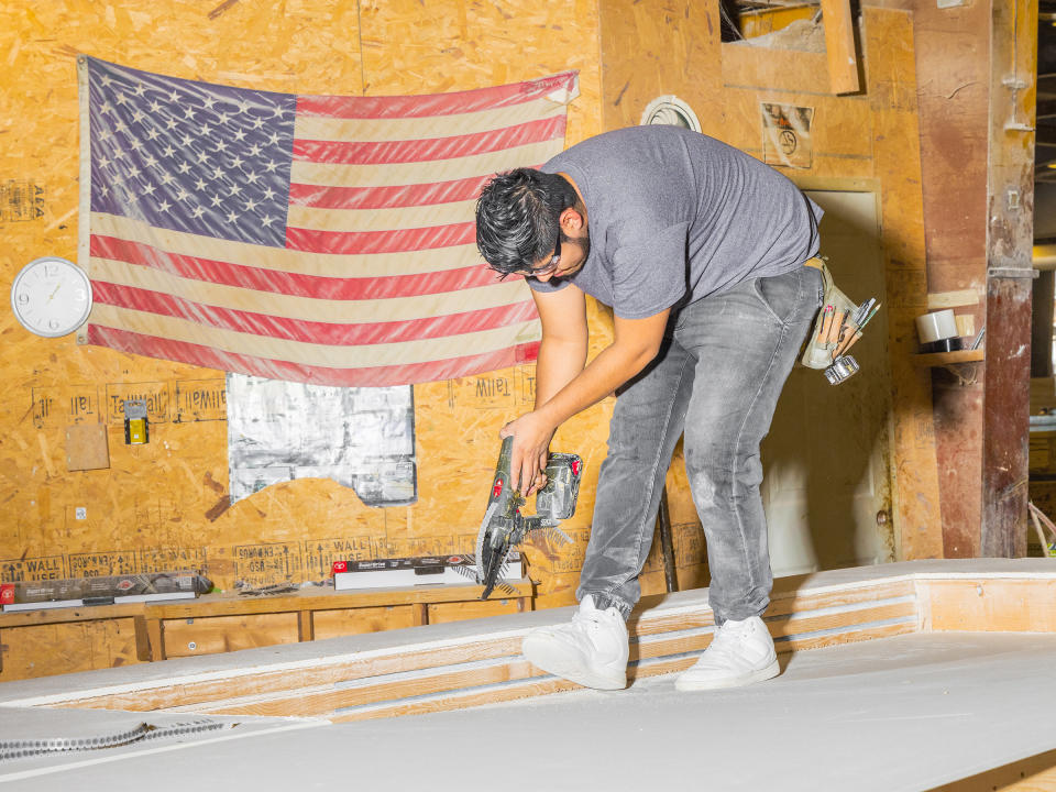 Early in the process, prefabrication work being performed at the Apex Homes factory.<span class="copyright">Evan Angelastro for TIME</span>