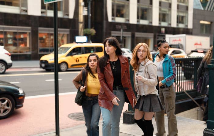 cassandra exiting a subway station with 3 other women