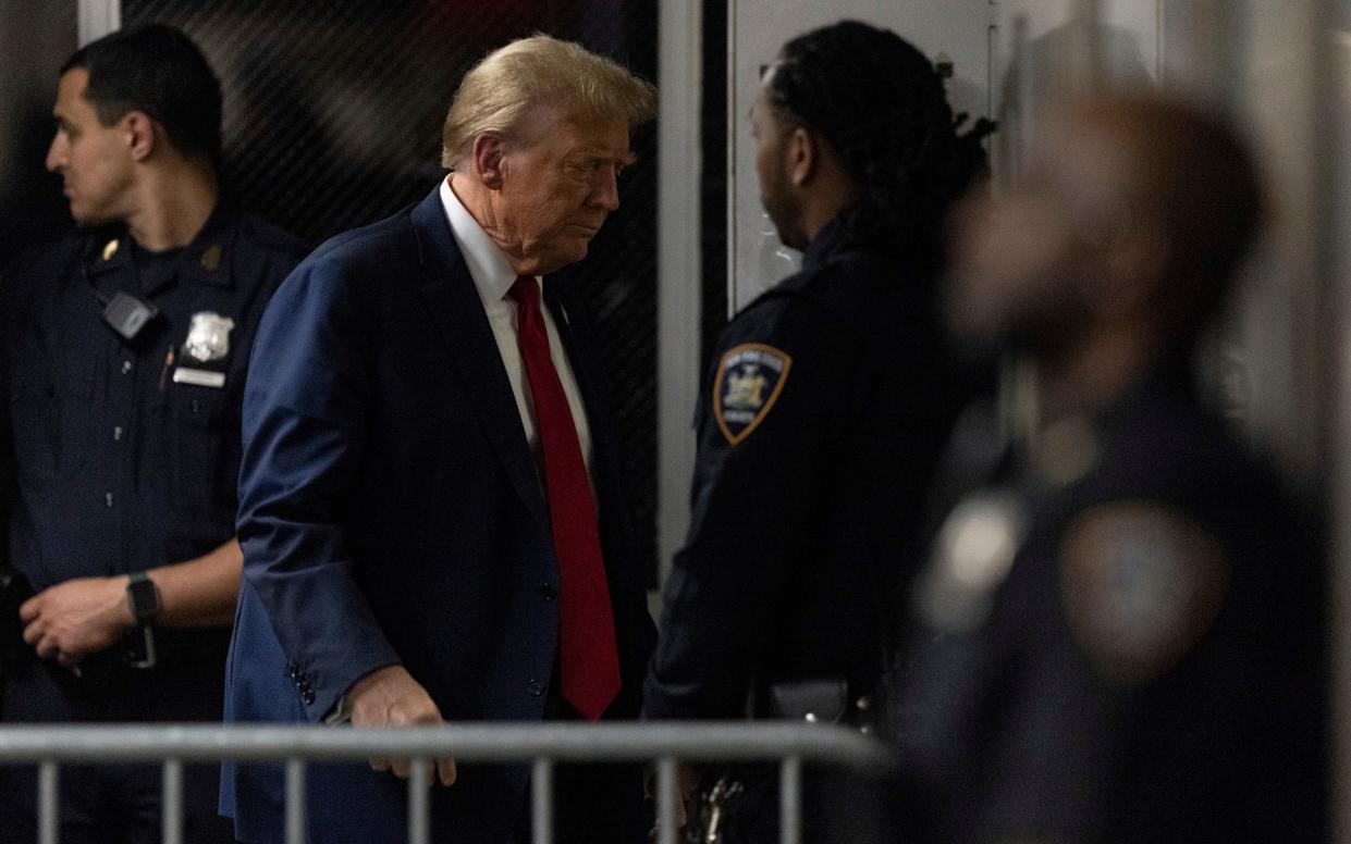 Donald Trump returns from a break from his trial at Manhattan criminal court