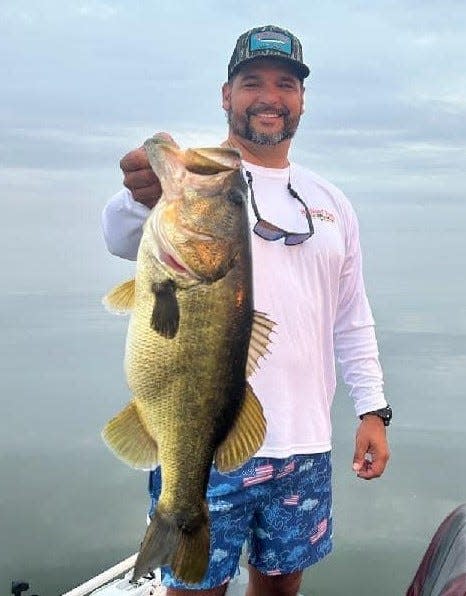 Henry Zuniga, of DeLeon Springs, shows off a largemouth bass that checked in at 9.4 pounds. He was fishing out of Highland Park Fish Camp with Capt. James Hillman.