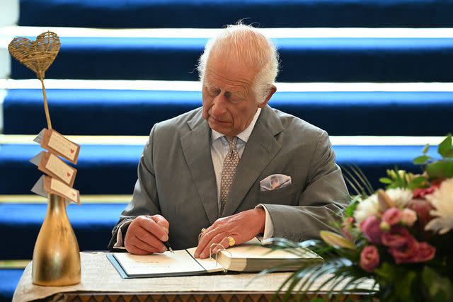 <p>PAUL ELLIS/POOL/AFP via Getty </p> King Charles signed the book of condolence in Southport, on Aug. 20, 2024.